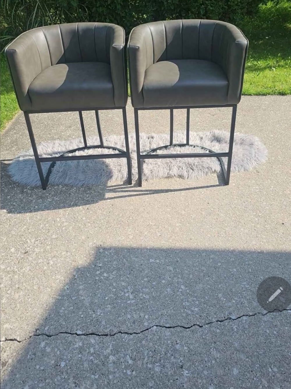 2 matching grey leather bar stools. Brand new.  Estate sale must go